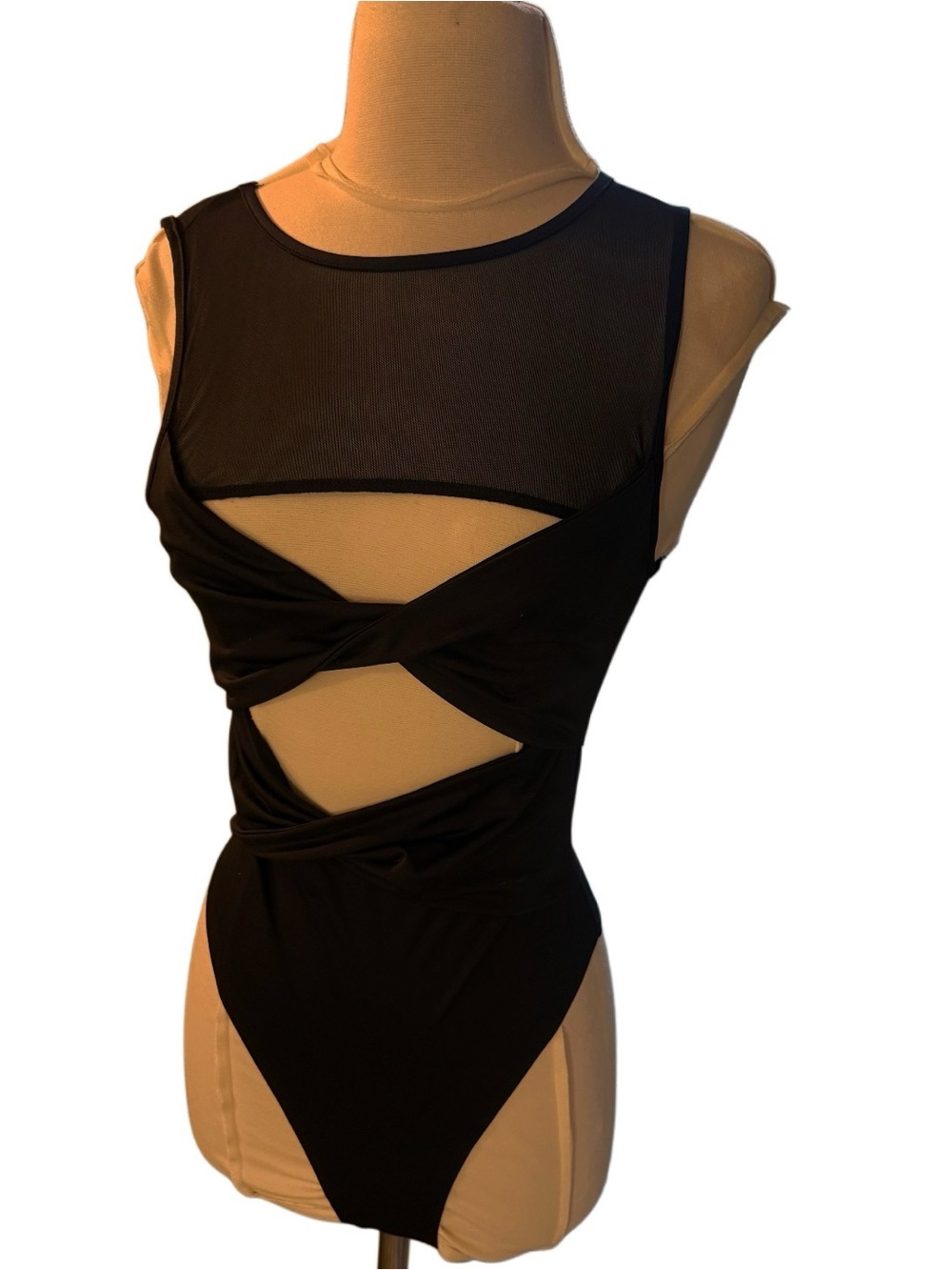 Kittenish x Revolve black cut out mesh Bodysuit Sz small
 Twist Front